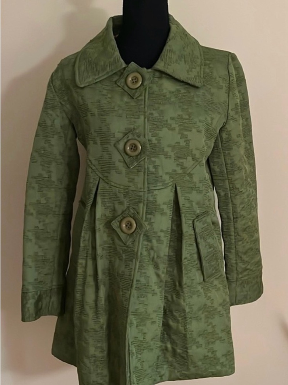 Vintage Maestro textured swing coat in a muted olive green hue